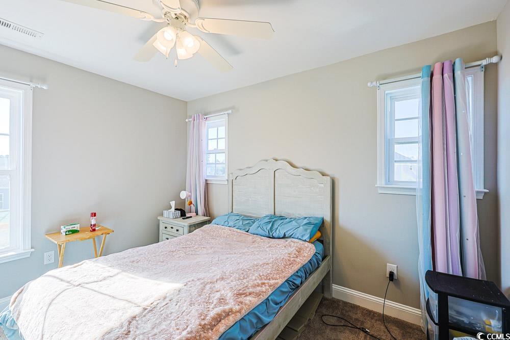 724 Hobonny Loop Longs, SC 29568 - Photo 17 of 40 Bedroom featuring baseboards and ceiling fan
