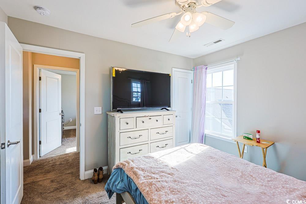 724 Hobonny Loop Longs, SC 29568 - Photo 18 of 40 Bedroom featuring dark colored carpet and a ceiling fan