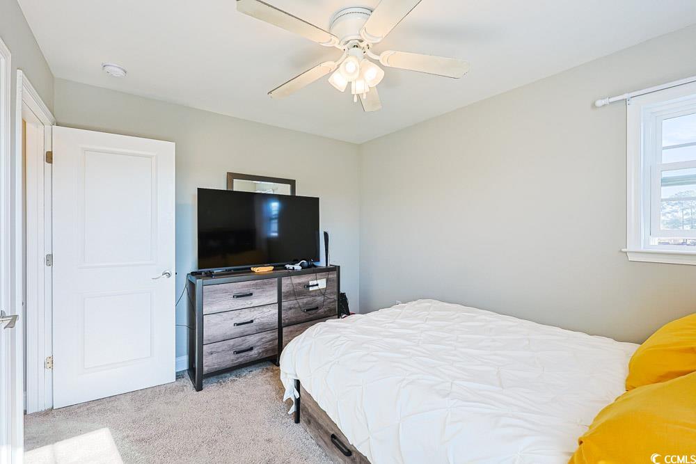 724 Hobonny Loop Longs, SC 29568 - Photo 24 of 40 Bedroom with light colored carpet and a ceiling fan