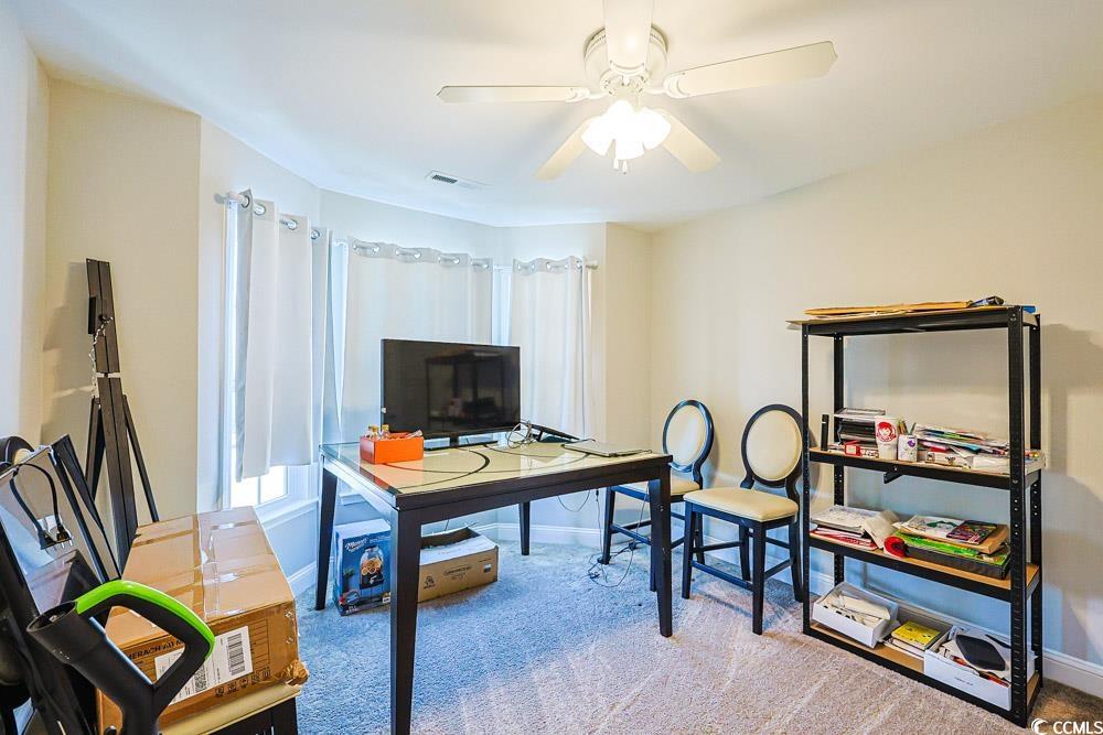 724 Hobonny Loop Longs, SC 29568 - Photo 26 of 40 Home office with light carpet and ceiling fan