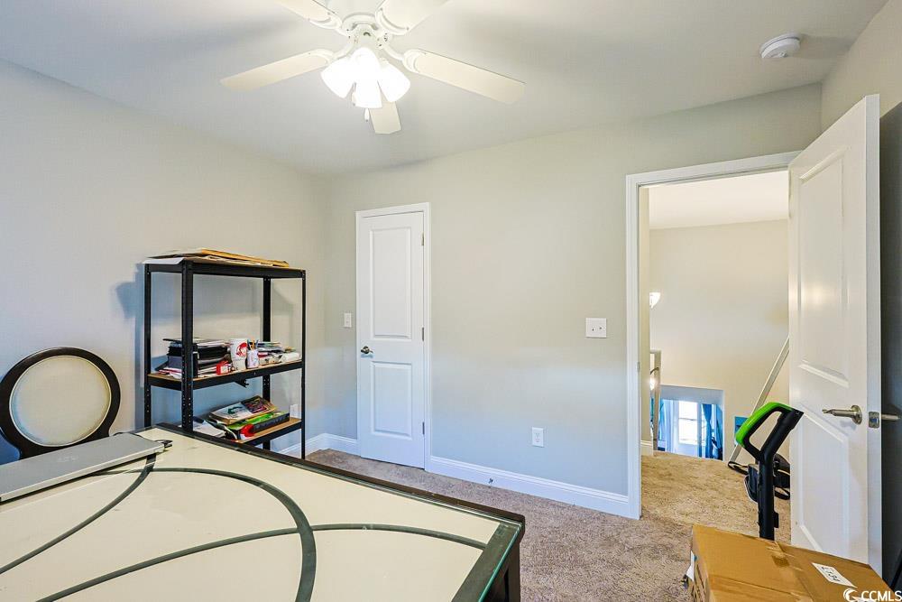 724 Hobonny Loop Longs, SC 29568 - Photo 27 of 40 Bedroom with light colored carpet, ceiling fan, and a desk
