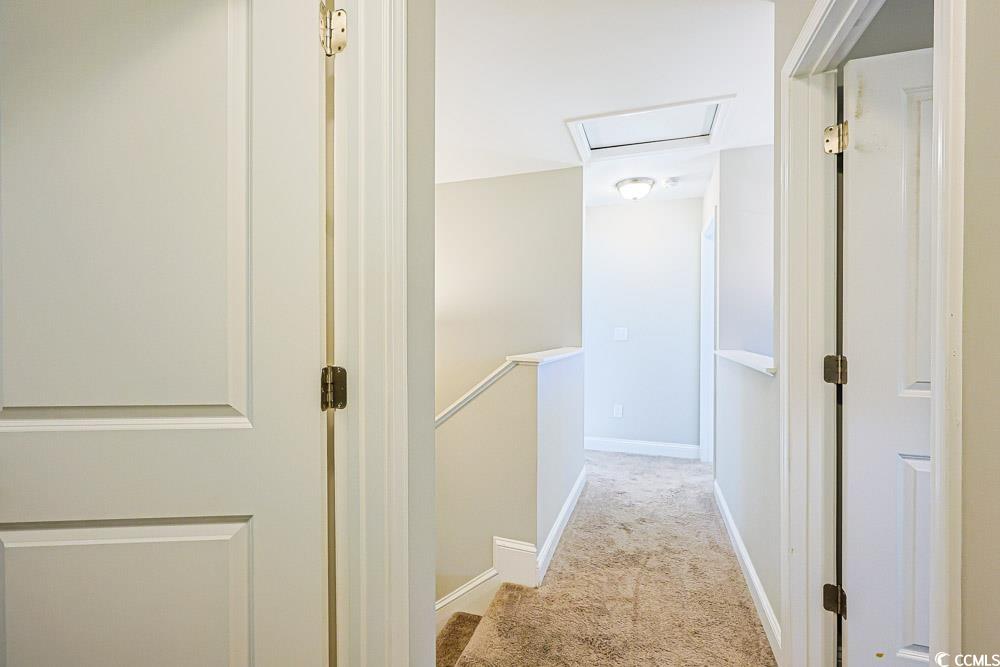 724 Hobonny Loop Longs, SC 29568 - Photo 28 of 40 Hall with an upstairs landing and light carpet