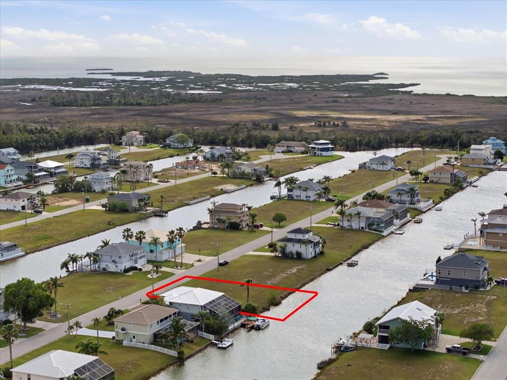 3487 Croaker Drive Hernando Beach, FL 34607 - Photo 16 of 27 an aerial view of a water residential house and ocean view