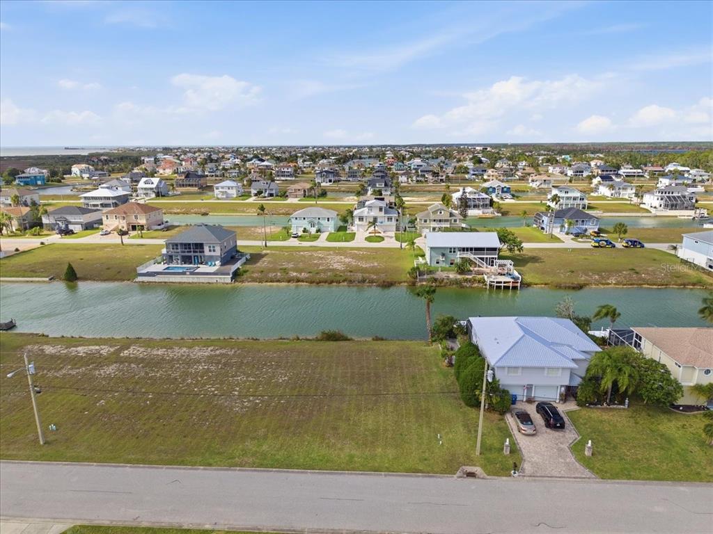 3487 Croaker Drive Hernando Beach, FL 34607 - Photo 2 of 27 an aerial view of residential houses with outdoor space and ocean view