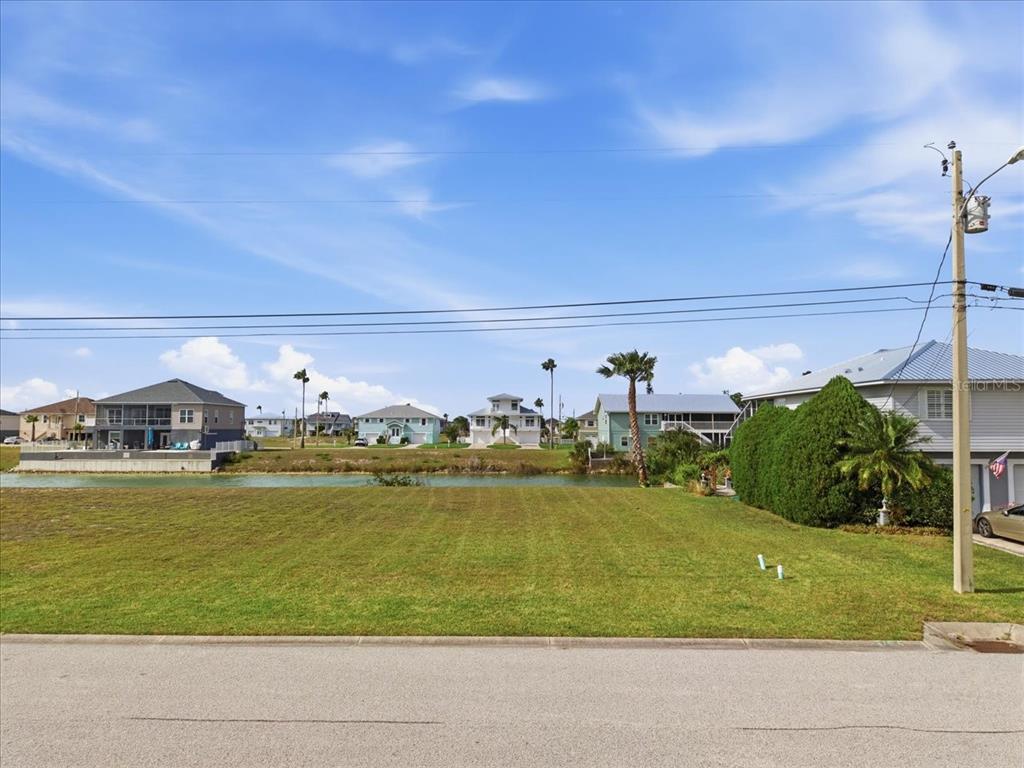 3487 Croaker Drive Hernando Beach, FL 34607 - Photo 5 of 27 a view of a swimming pool with a yard