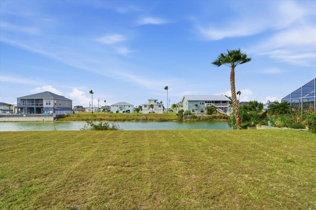 3487 Croaker Drive Hernando Beach, FL 34607 - Photo 8 of 27 a view of an ocean with a house