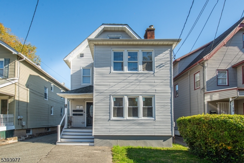 41 Elmwood Avenue, Unit 1 Montclair, NJ 07042 - Photo 1 of 18 a front view of a house with a porch
