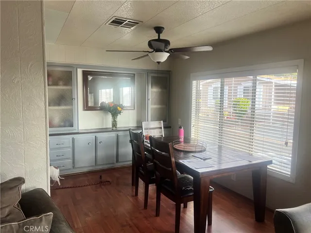 a view of a dining room with furniture and window