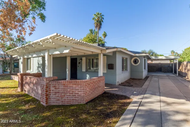 a view of a house with a tub and a garden