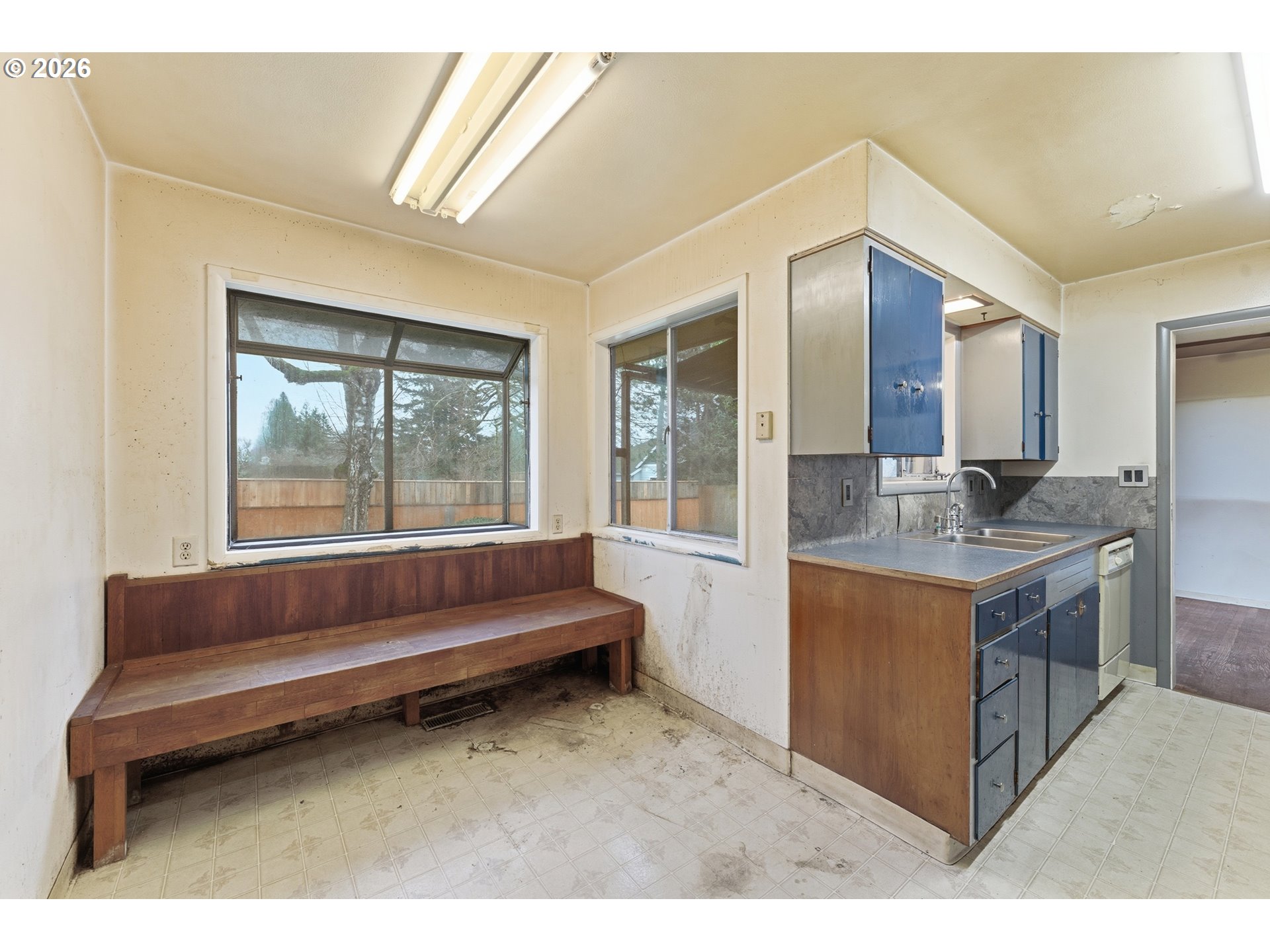 64 Northwest Florence Avenue Gresham, OR 97030 - Photo 16 of 29 a living room with kitchen island furniture and a kitchen view