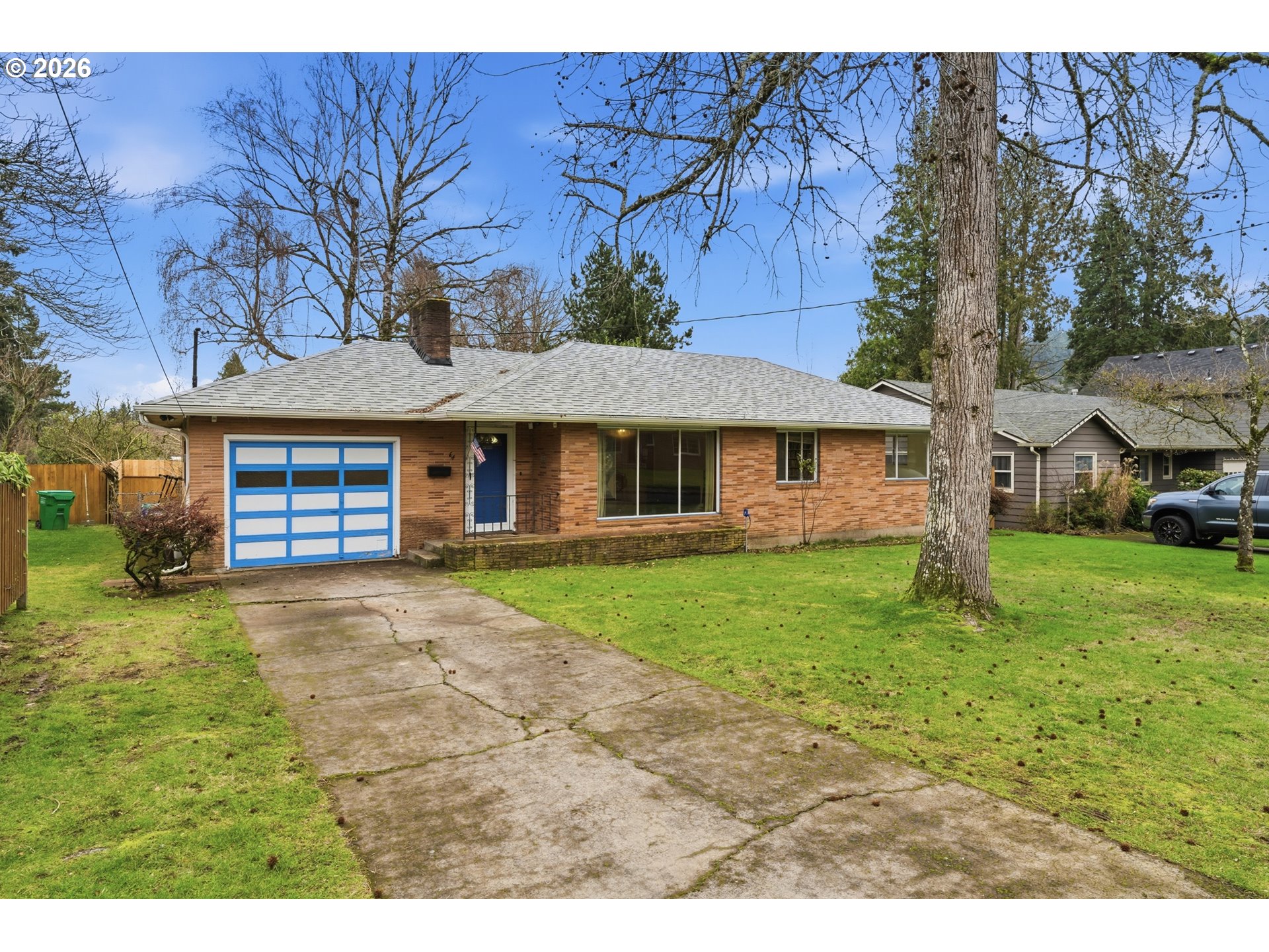64 Northwest Florence Avenue Gresham, OR 97030 - Photo 2 of 29 a front view of a house with a garden and porch