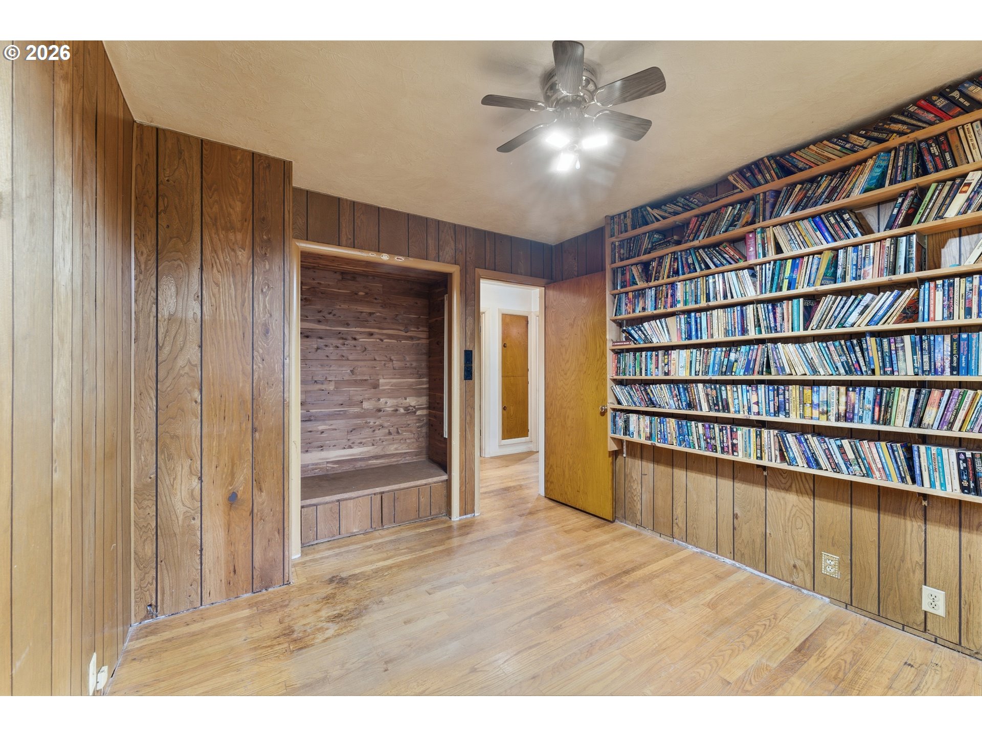 64 Northwest Florence Avenue Gresham, OR 97030 - Photo 23 of 29 a view of an empty room with a bookshelf