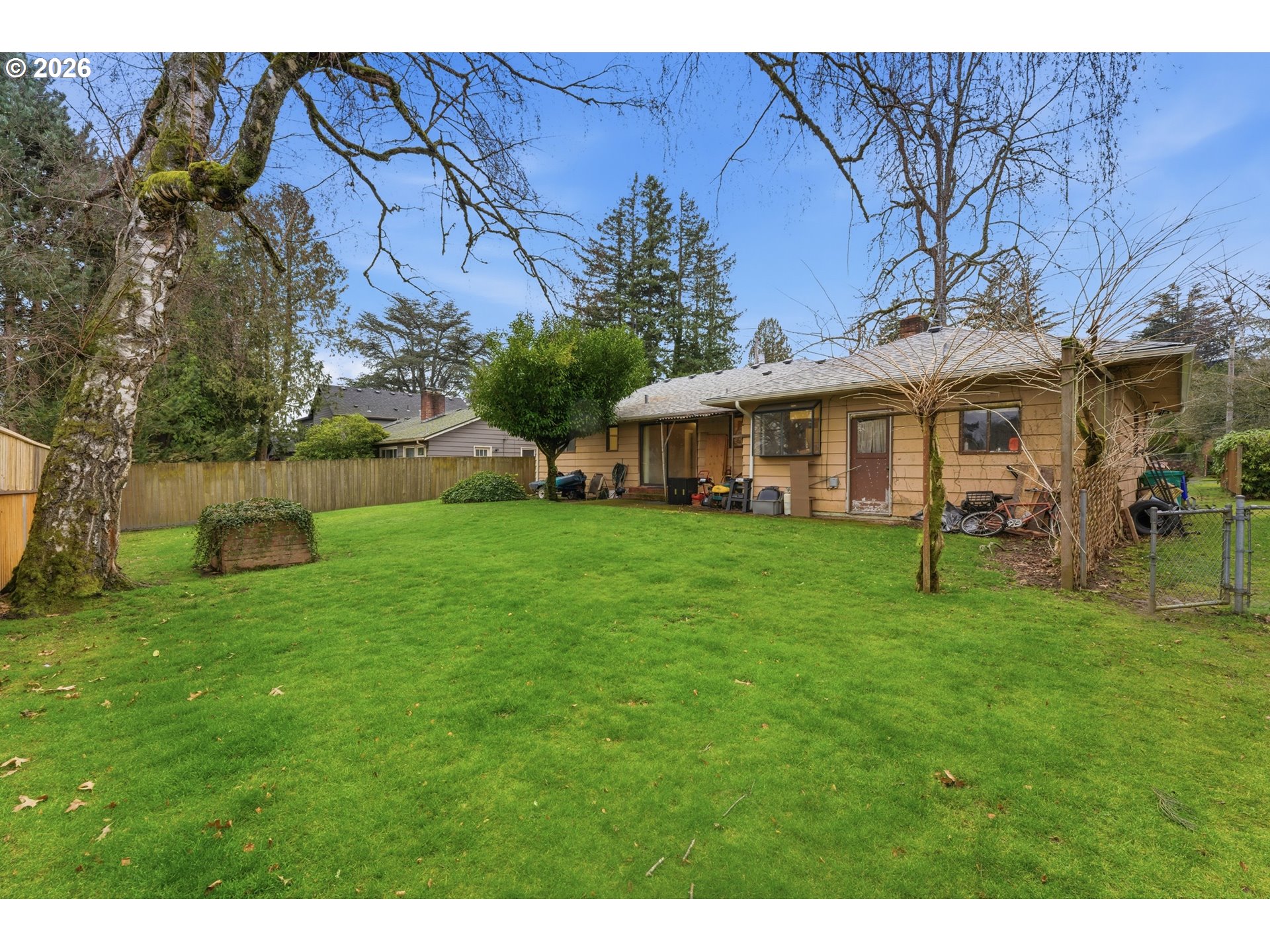 64 Northwest Florence Avenue Gresham, OR 97030 - Photo 26 of 29 a view of a house with a backyard