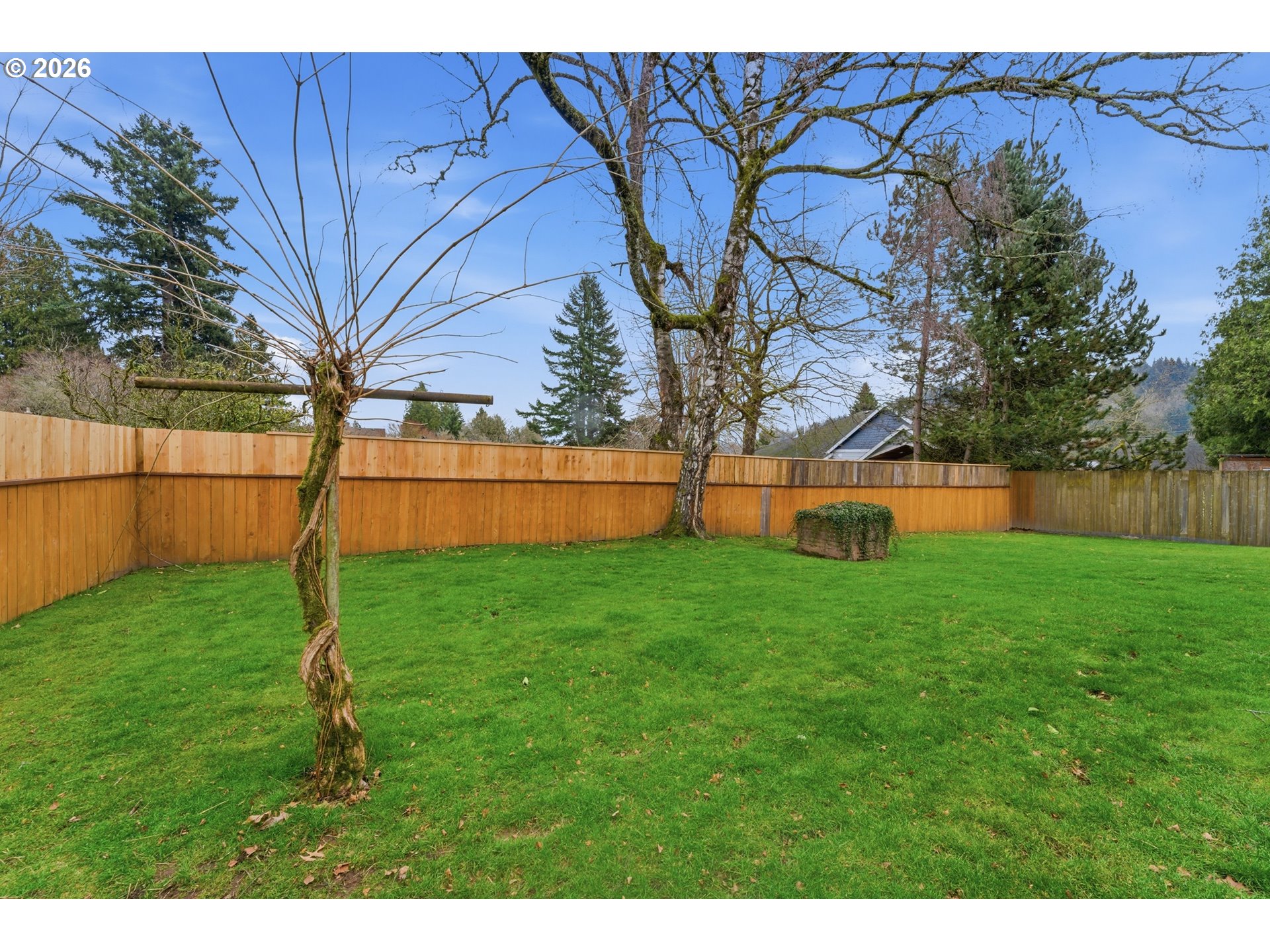 64 Northwest Florence Avenue Gresham, OR 97030 - Photo 27 of 29 a backyard of a house with lots of green space