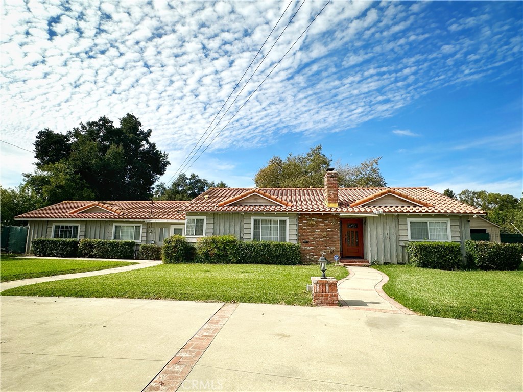 13218 McKinley Avenue Chino, CA 91710 - Photo 1 of 14 a front view of a house with a yard