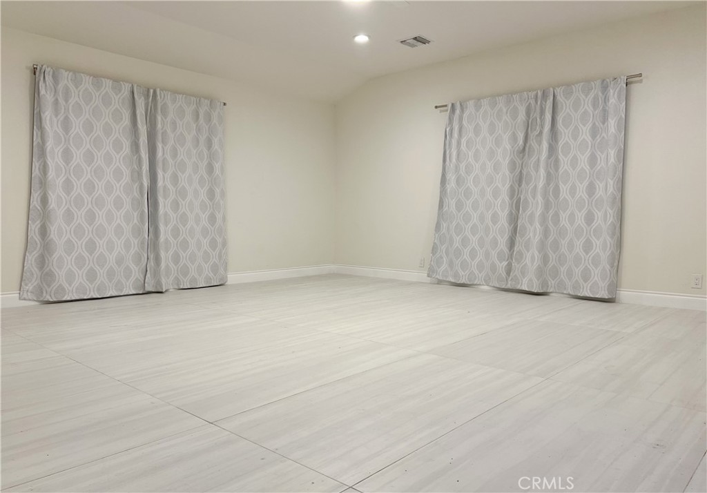 13218 McKinley Avenue Chino, CA 91710 - Photo 12 of 14 a view of an empty room with a window