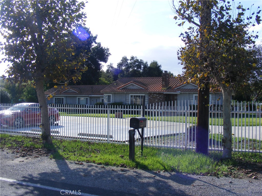 13218 McKinley Avenue Chino, CA 91710 - Photo 14 of 14 a view of a wrought iron fences in front of house