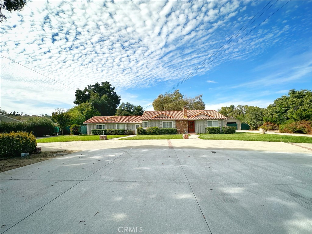 13218 McKinley Avenue Chino, CA 91710 - Photo 2 of 14 a view of a swimming pool and trees in the background