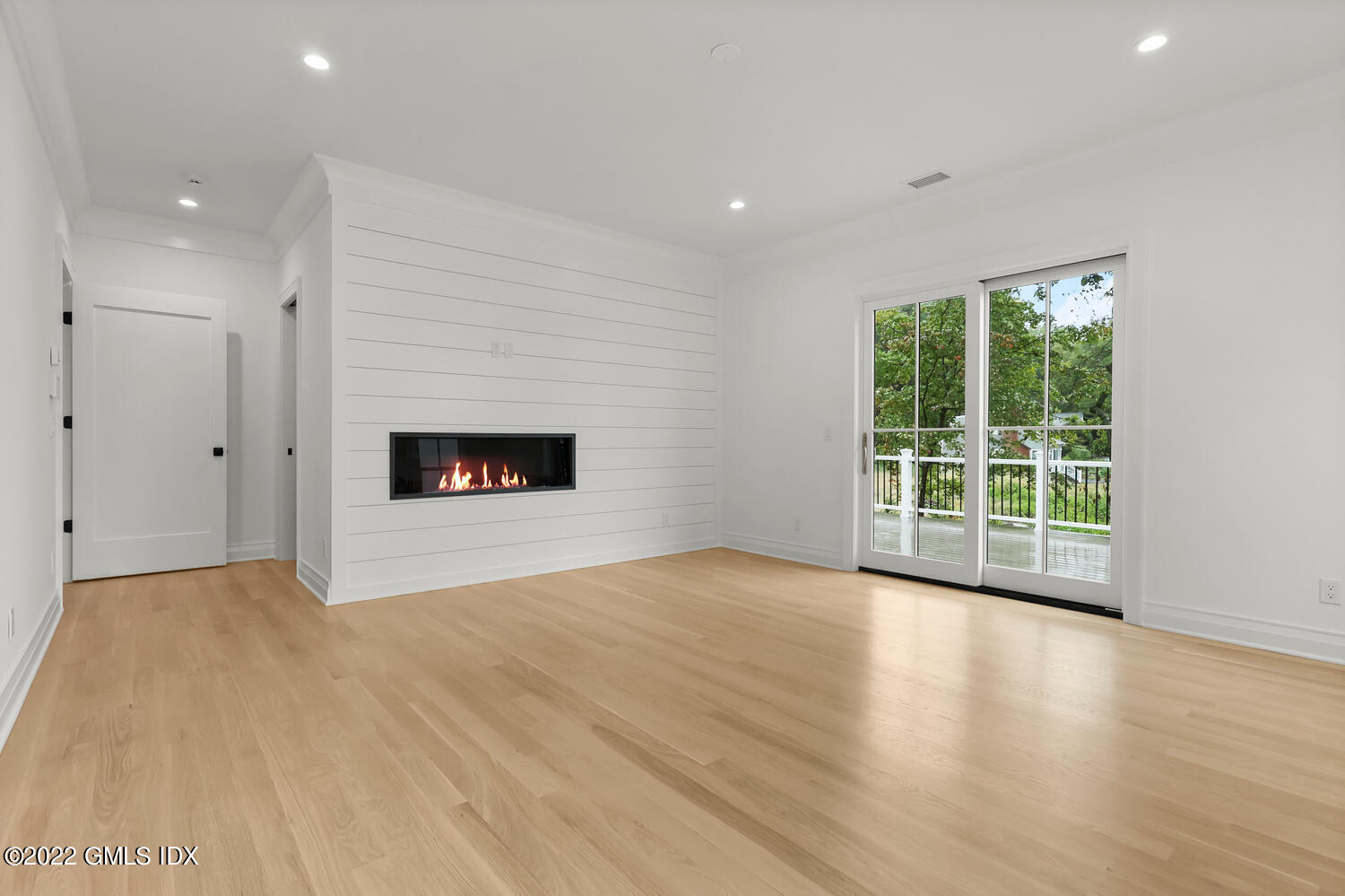 108 Sheephill Road Riverside, CT 06878 - Photo 19 of 47 a view of empty room with wooden floor and fireplace