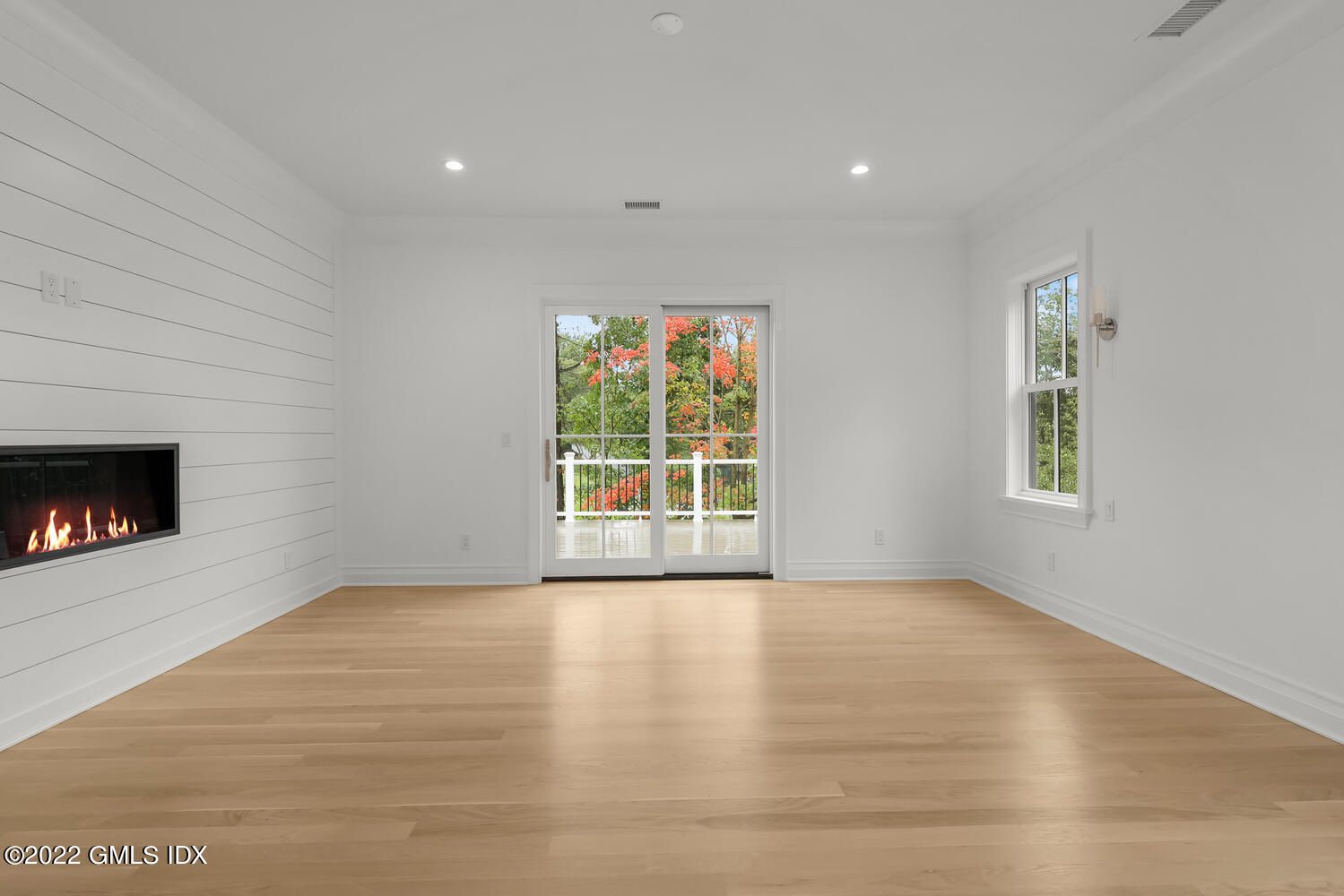 108 Sheephill Road Riverside, CT 06878 - Photo 20 of 47 a view of an empty room with a window and fireplace
