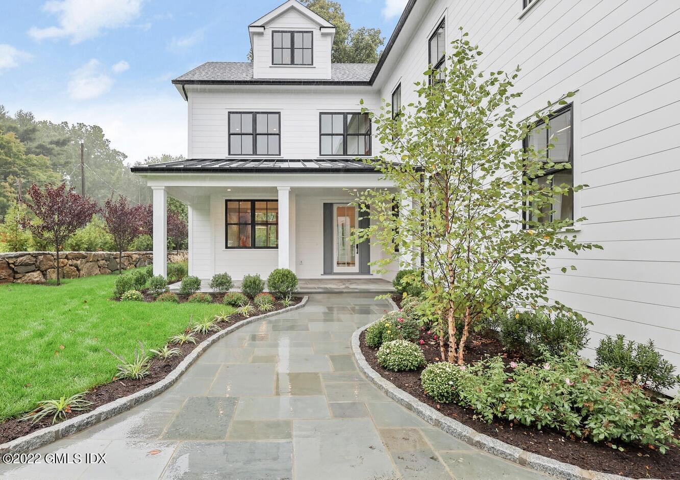 108 Sheephill Road Riverside, CT 06878 - Photo 2 of 47 front view of a house with a yard