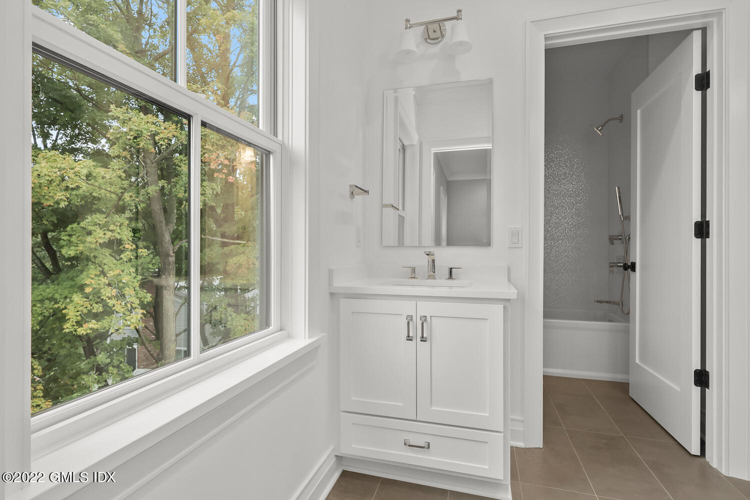 108 Sheephill Road Riverside, CT 06878 - Photo 34 of 47 a bathroom with a sink a mirror and a bathtub