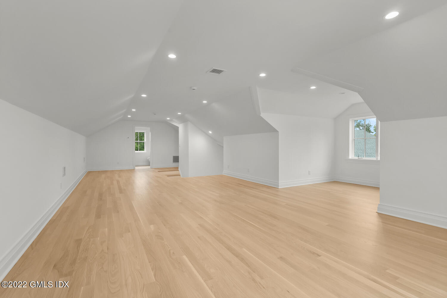 108 Sheephill Road Riverside, CT 06878 - Photo 37 of 47 a view of an empty room with wooden floor and a window