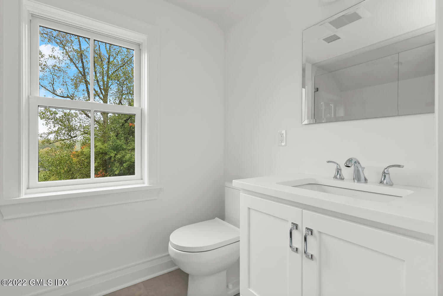 108 Sheephill Road Riverside, CT 06878 - Photo 38 of 47 a bathroom with a sink a toilet and a window