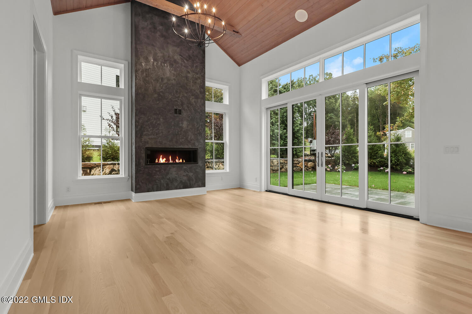 108 Sheephill Road Riverside, CT 06878 - Photo 5 of 47 a view of an empty room with a fireplace and a window