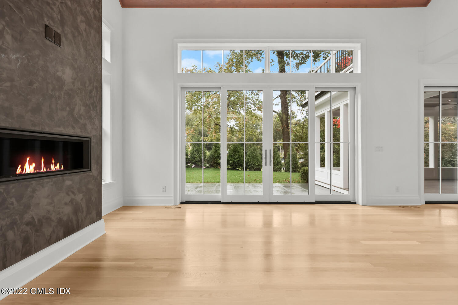108 Sheephill Road Riverside, CT 06878 - Photo 7 of 47 a view of an empty room with wooden floor and a fireplace