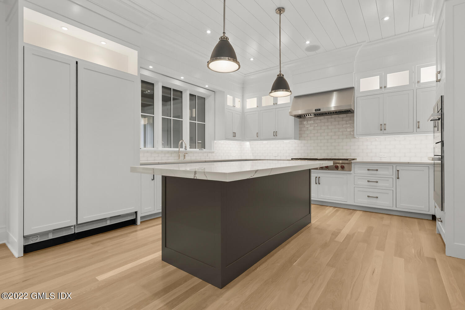 108 Sheephill Road Riverside, CT 06878 - Photo 8 of 47 a kitchen with stainless steel appliances granite countertop a sink a stove a refrigerator and island with wooden floor