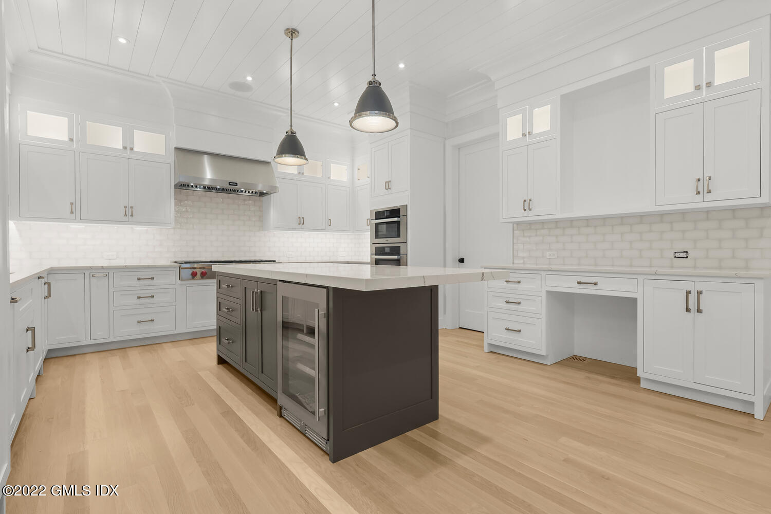 108 Sheephill Road Riverside, CT 06878 - Photo 9 of 47 a kitchen with a stove a sink a center island and a window