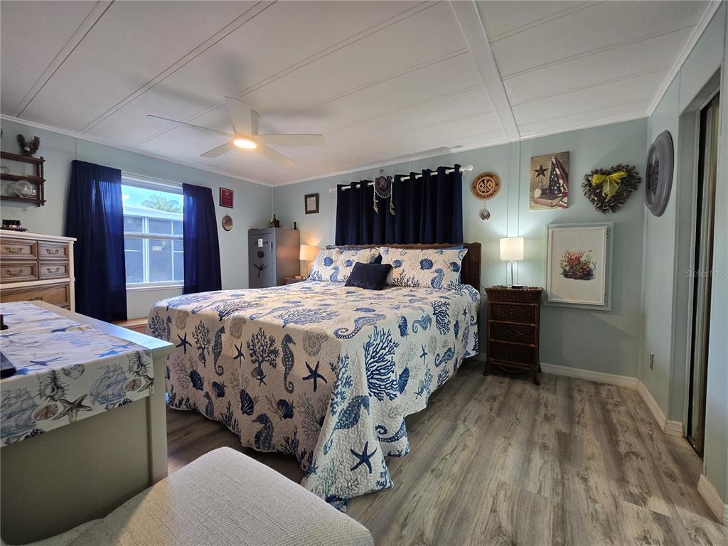 5619 Bayshore Road, Unit 435 Palmetto, FL 34221 - Photo 27 of 56 a bedroom with a bed and a dresser