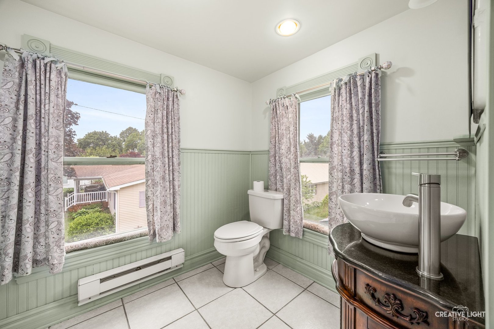 209 North Shabbona Road Shabbona, IL 60550 - Photo 16 of 25 a bathroom with a toilet sink and mirror