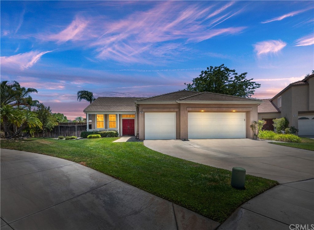 7891 Angus Way Riverside, CA 92508 - Photo 1 of 1 a front view of a house with a yard and garage