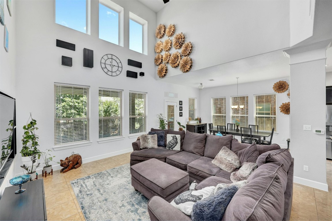 628 Loma Cedro Bend Leander, TX 78641 - Photo 1 of 1 a living room with furniture fireplace and large windows