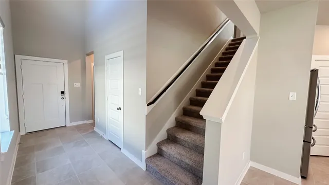 a view of an entryway with staircase