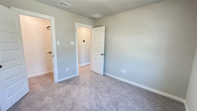 wooden floor and closet in a room