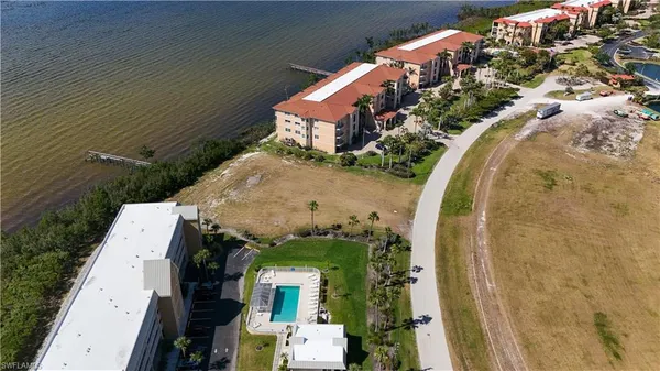 an aerial view of a house with a swimming pool