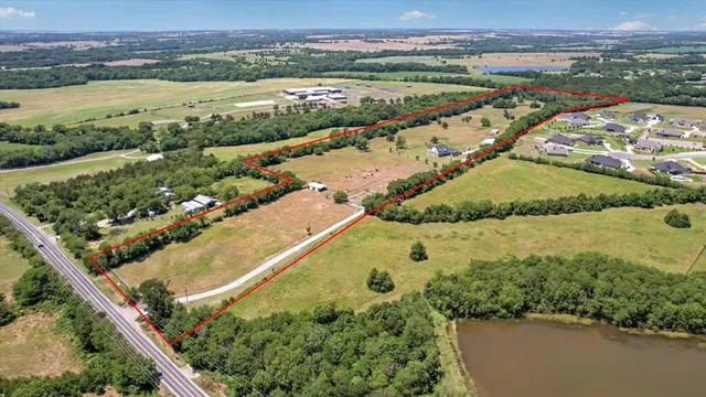 an aerial view of ocean residential houses with outdoor space and river