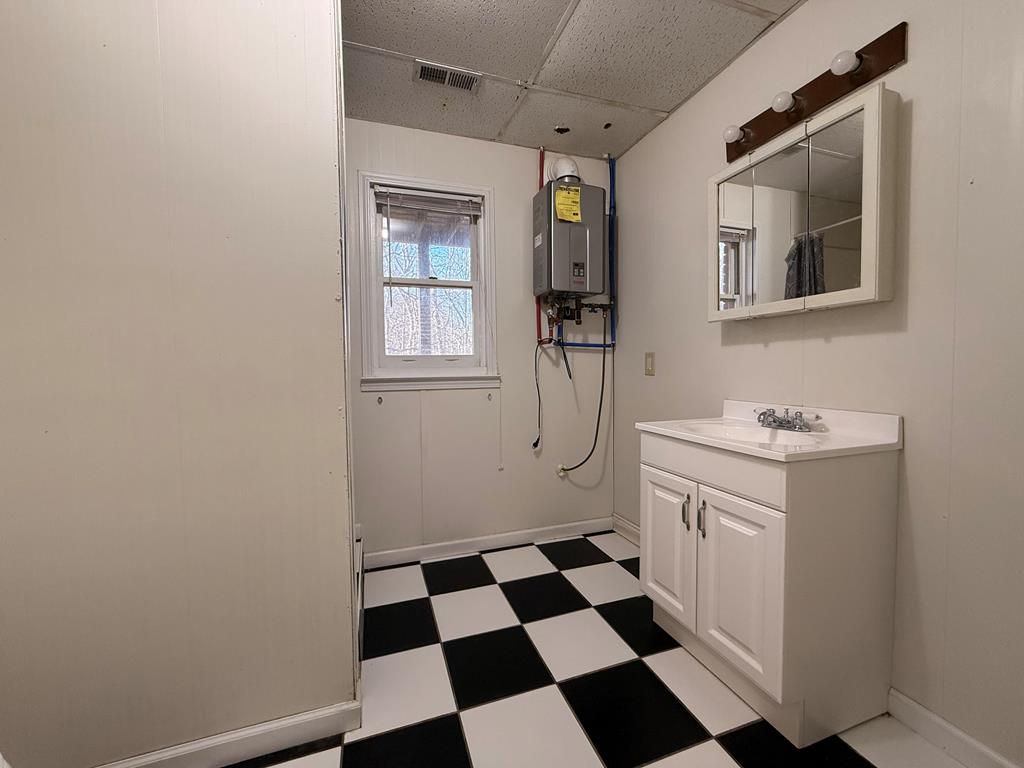 200 Sowers Road Blue Ridge, GA 30513 - Photo 13 of 19 a bathroom with a sink a toilet and a mirror