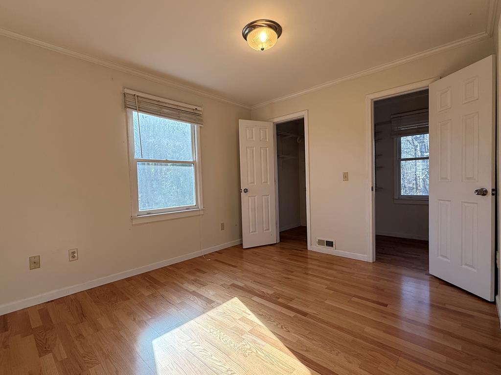 200 Sowers Road Blue Ridge, GA 30513 - Photo 6 of 19 an empty room with wooden floor and windows
