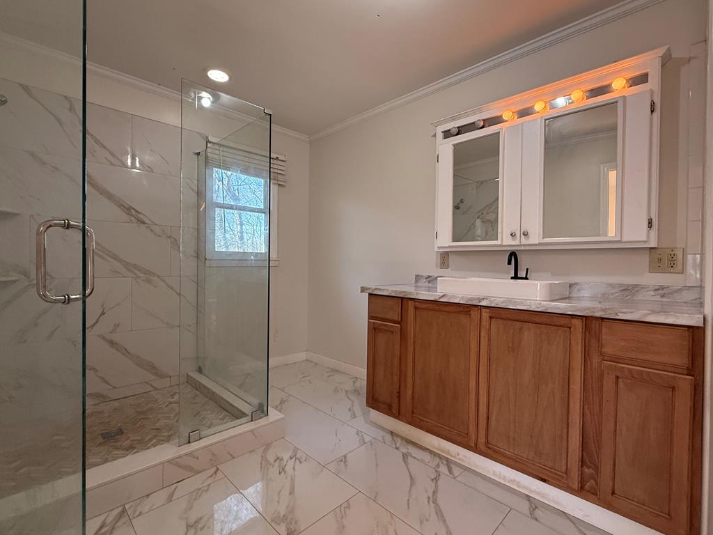 200 Sowers Road Blue Ridge, GA 30513 - Photo 7 of 19 a bathroom with a granite countertop sink mirror and vanity