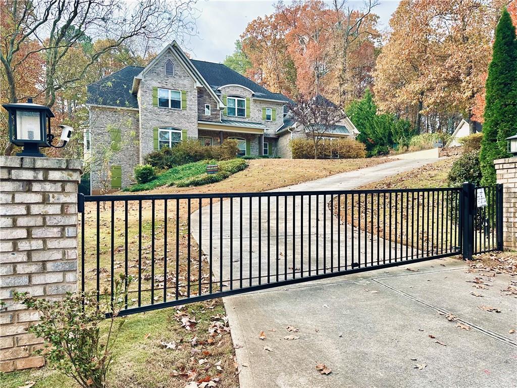 3232 Brookview Road Marietta, GA 30067 - Photo 1 of 86 a front view of a house with a trees