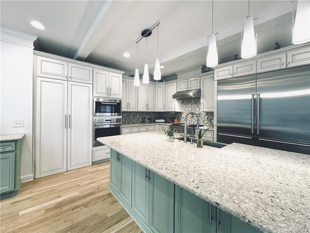 3232 Brookview Road Marietta, GA 30067 - Photo 18 of 86 a kitchen with kitchen island granite countertop a large counter top stainless steel appliances and cabinets