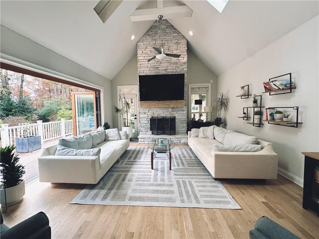 3232 Brookview Road Marietta, GA 30067 - Photo 22 of 86 a living room with furniture a flat screen tv and a fireplace