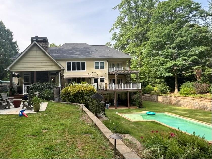 3232 Brookview Road Marietta, GA 30067 - Photo 76 of 86 a front view of a house with a yard table and chairs