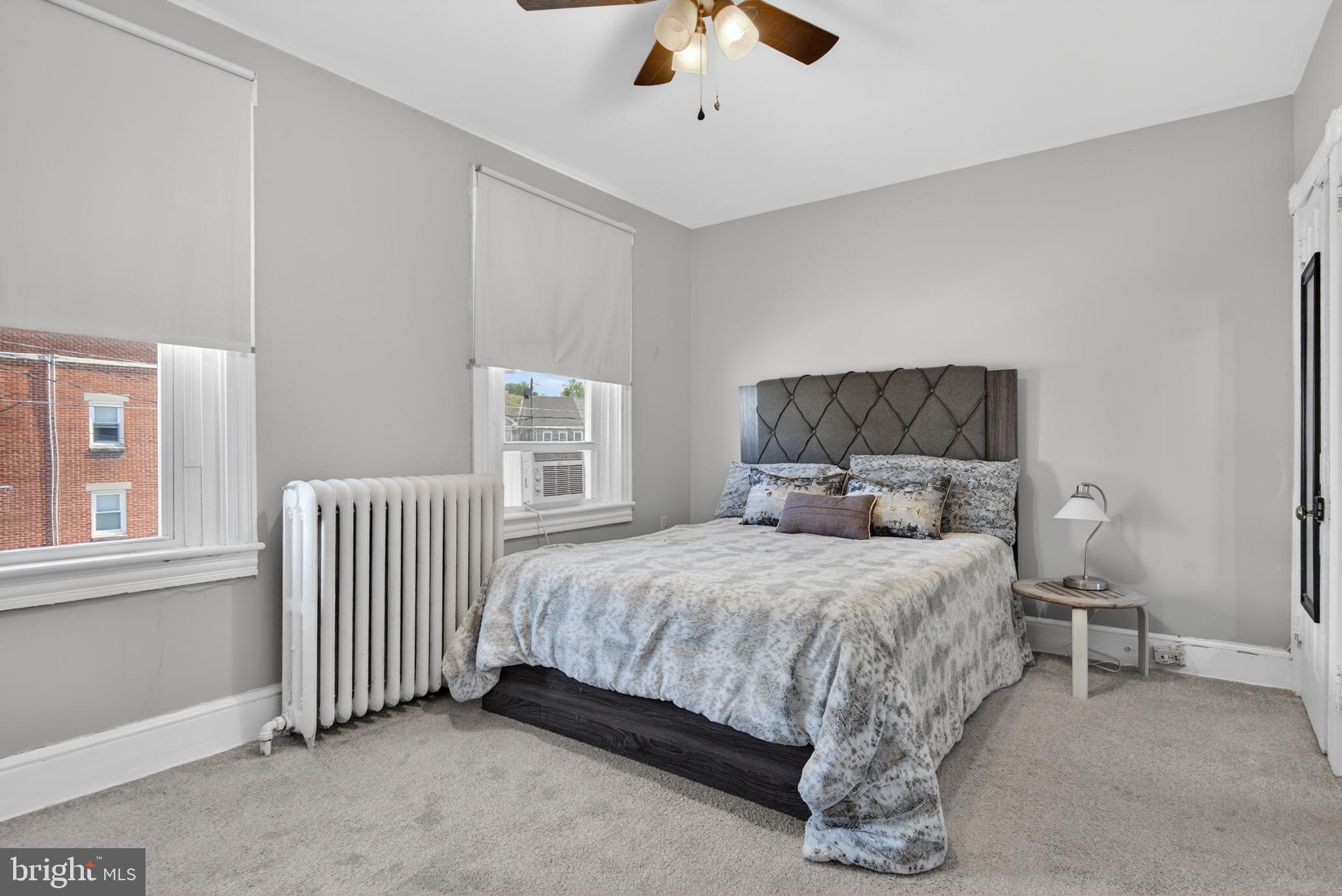 214 Duke Street Ephrata, PA 17522 - Photo 23 of 41 a bedroom with a bed and a chandelier