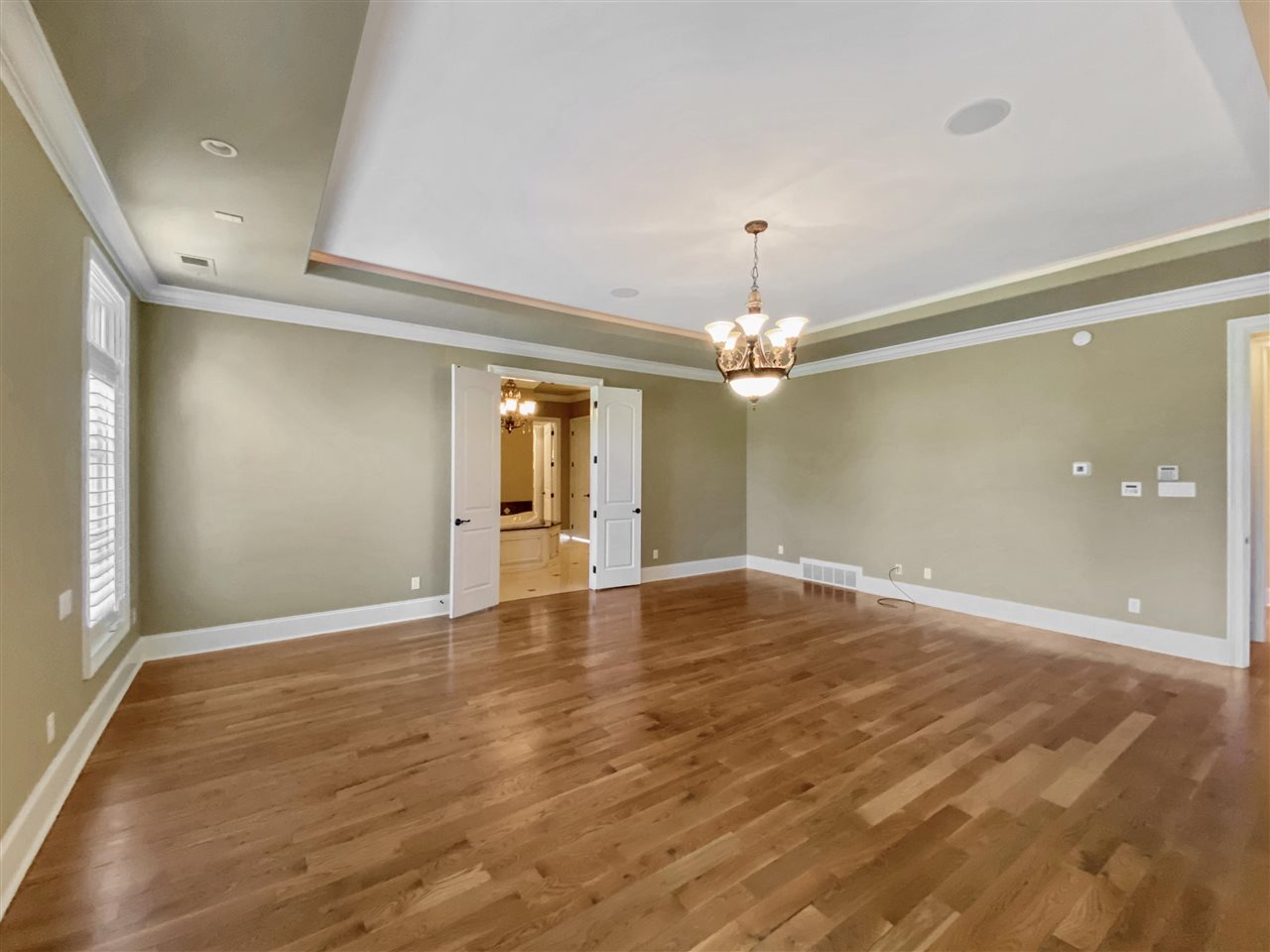 400 Buckland Cove Eads, TN 38028 - Photo 12 of 25 wooden floor in an empty room with a window