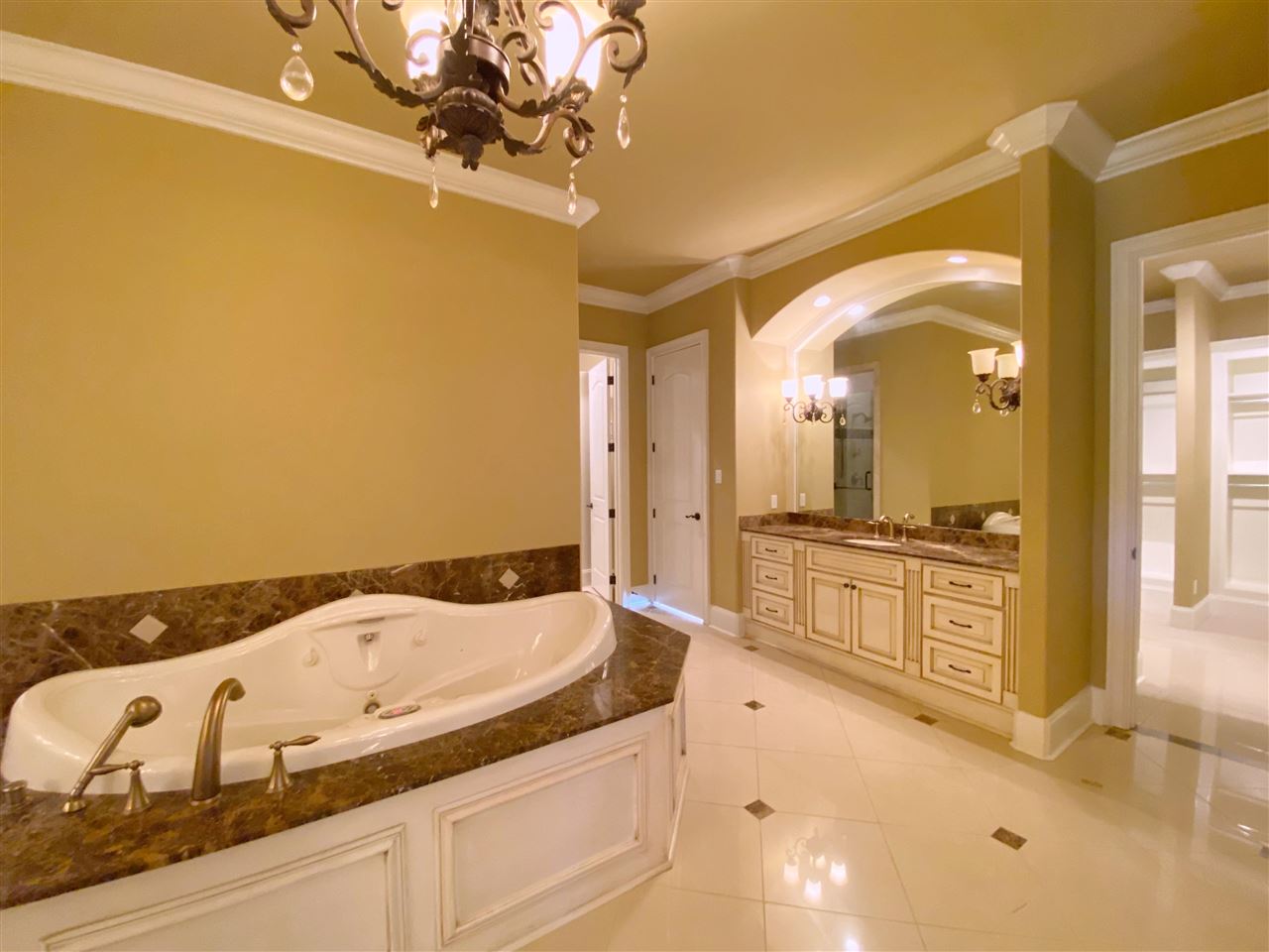 400 Buckland Cove Eads, TN 38028 - Photo 14 of 25 a spacious bathroom with a granite countertop sink a mirror and shower